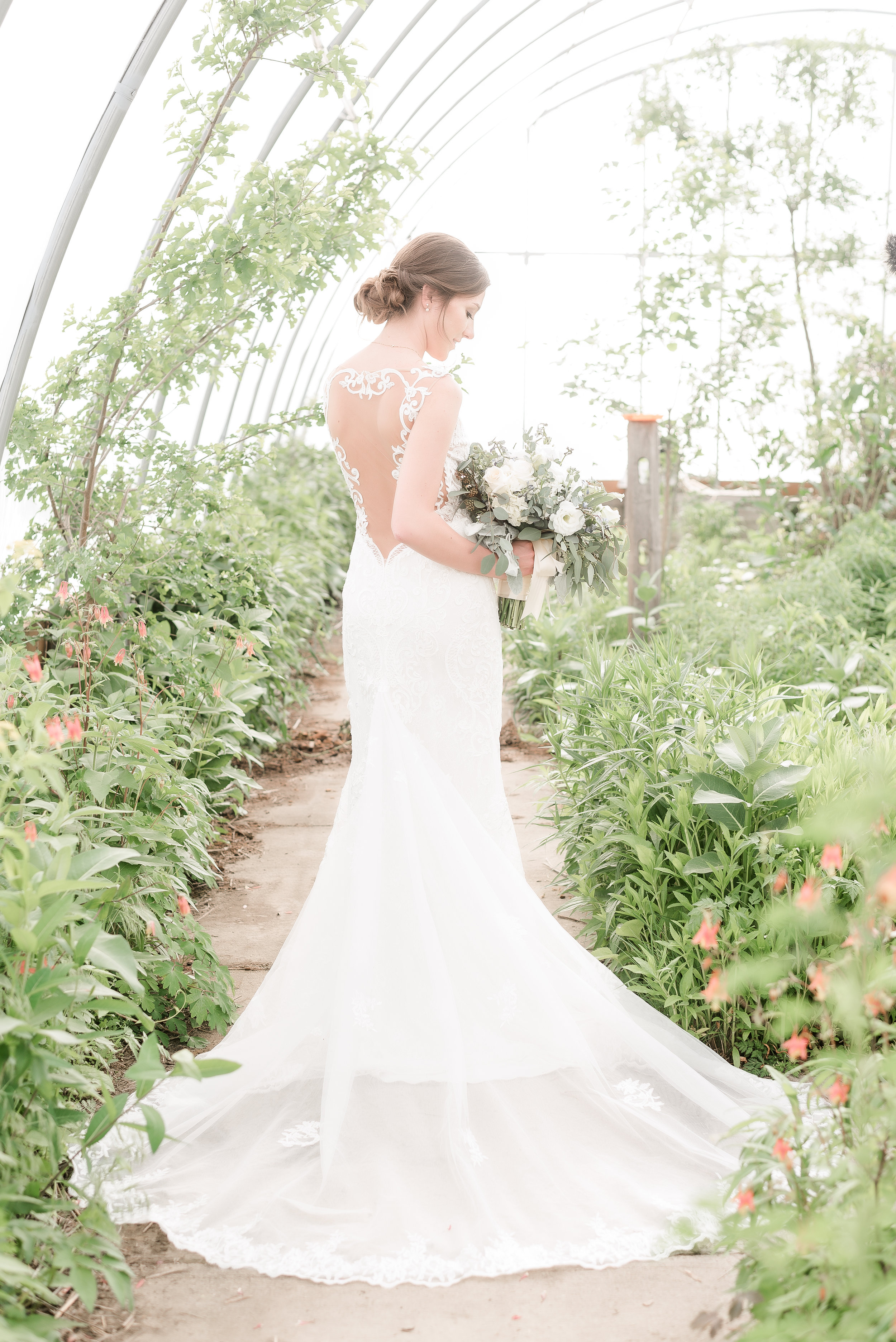 Bride in Greenhouse back of dress