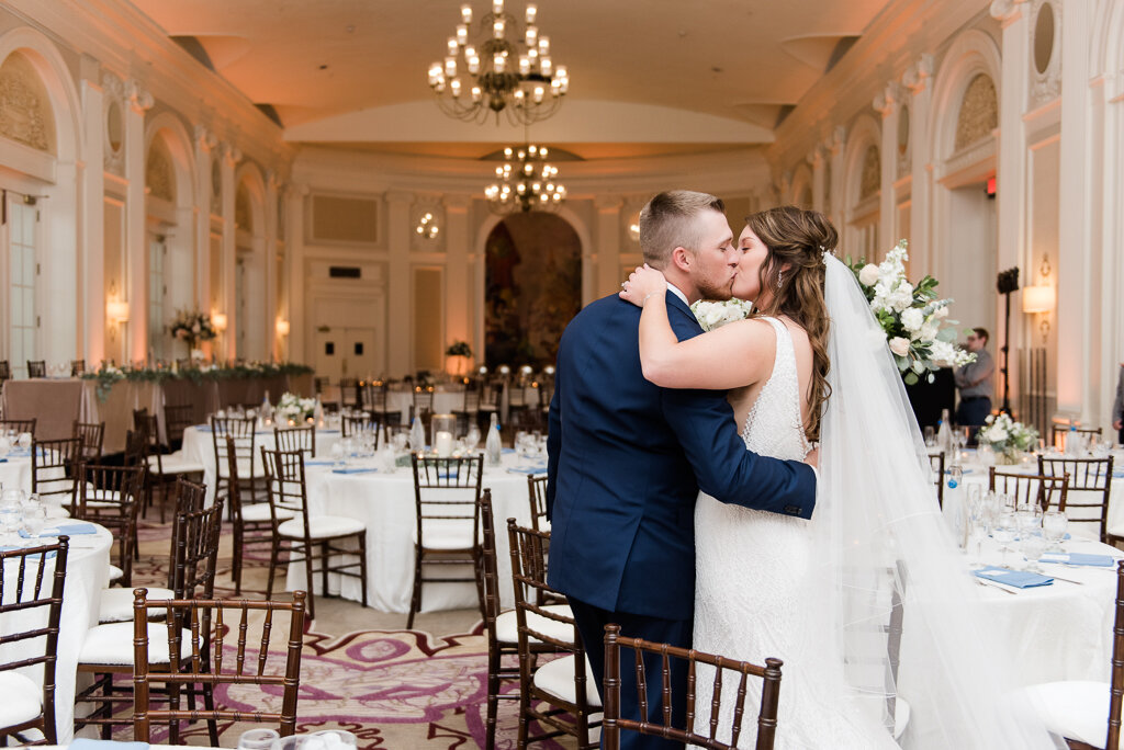 bride and groom kissing at reception