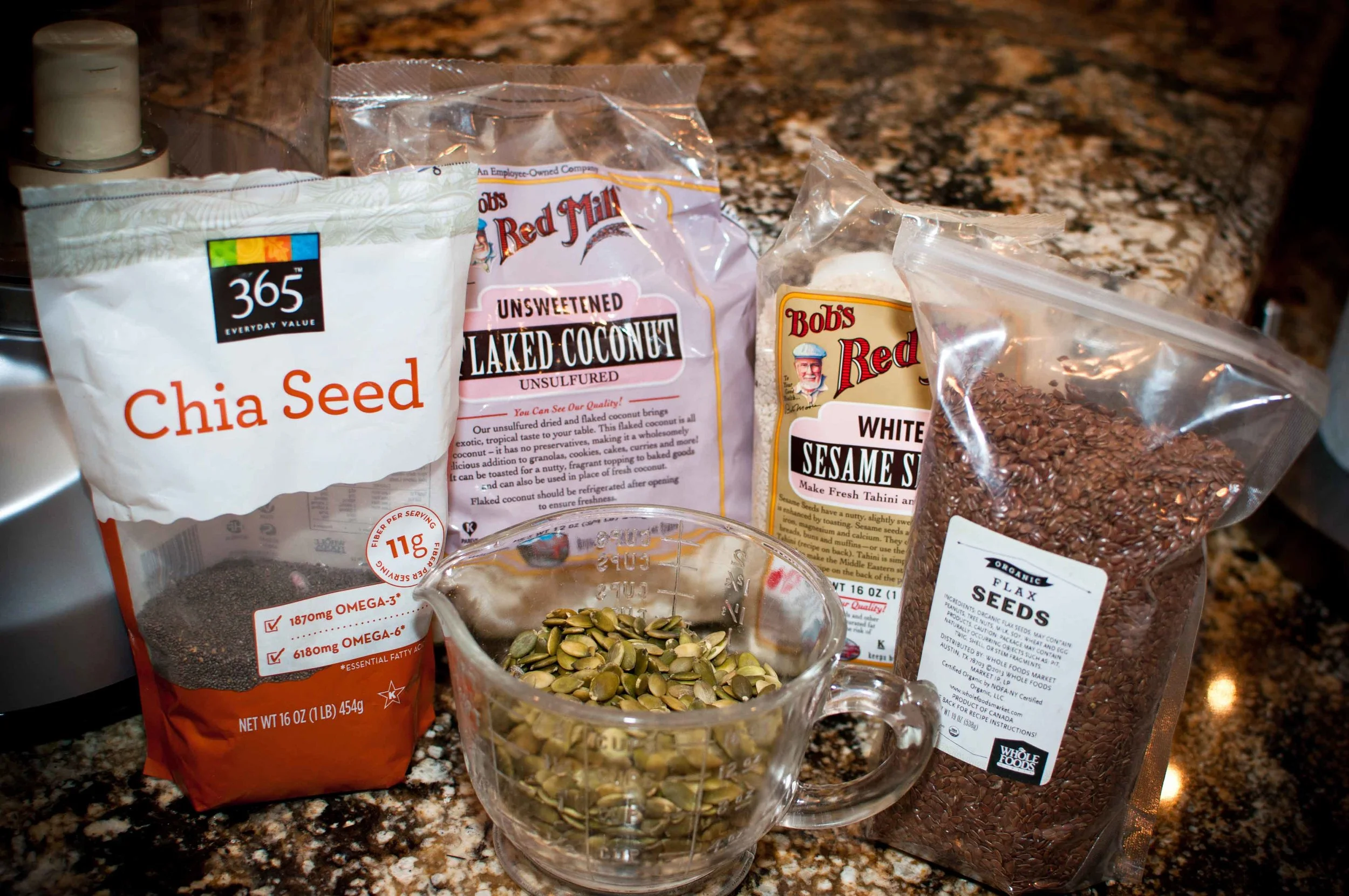 Dry ingredients: 1/2 cup sprouted pumpkin seeds 1 cup unsweetened flaked coconut 1/4 cup organic flax seeds 1/3 cup raw sunflower seeds 4 tablespoon chia seeds 1/2 cup Naked Whey Protein or Naked Pea Protein (if you are vegan) * Please note that this recipe has been edited since it was first published. I've been playing with the ingredients and trying to determine which combinations deliver the best tasting bar. So some ingredients in the recipe may differ from the attached photos.