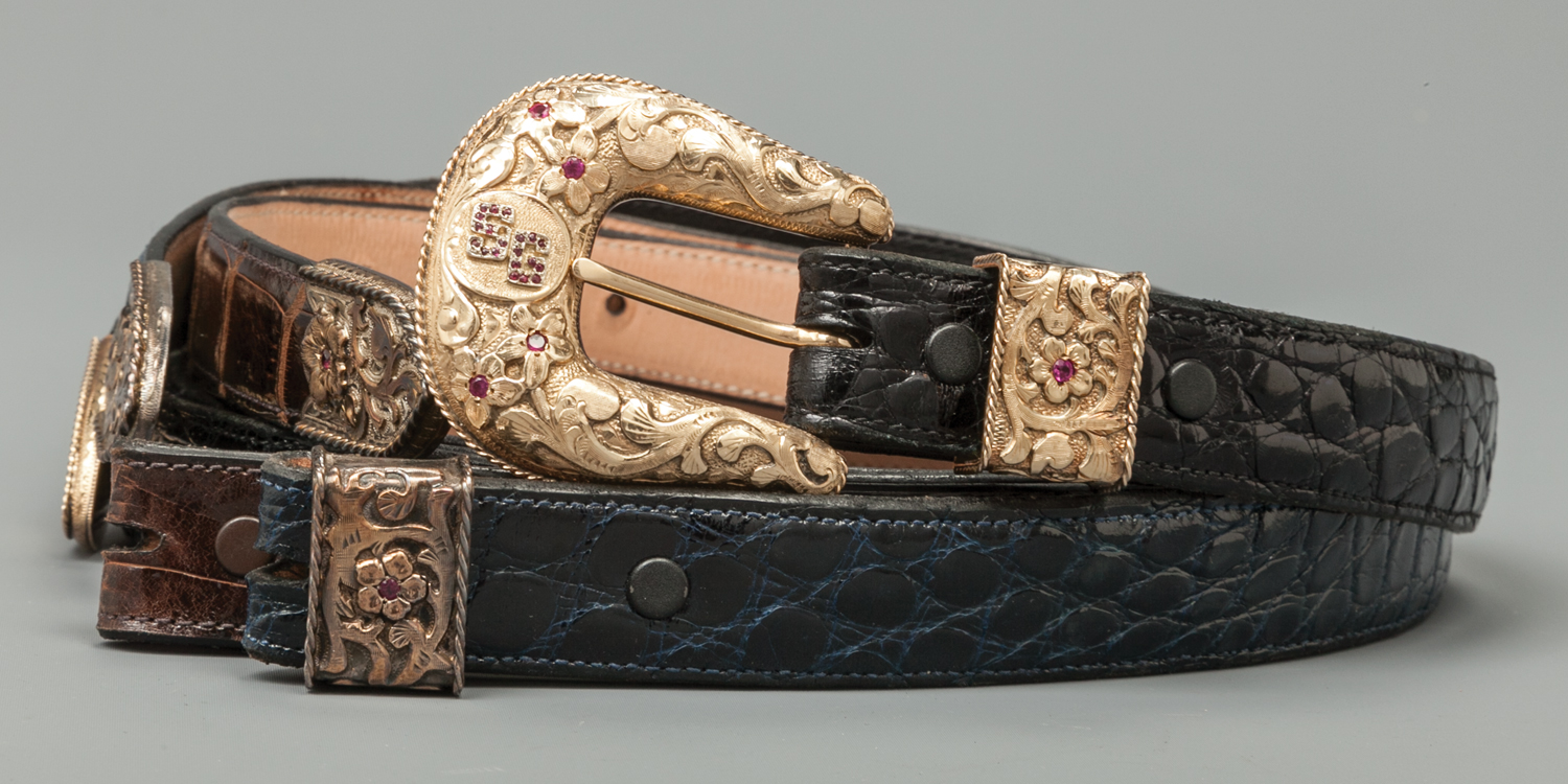 Lot 86: 18K Gold Edward H. Bohlin Buckle Set with Rubies, and Exotic Belts with Extra Tips, Sold $3,835. Provenance: From the Estate of Snuff Garrett
