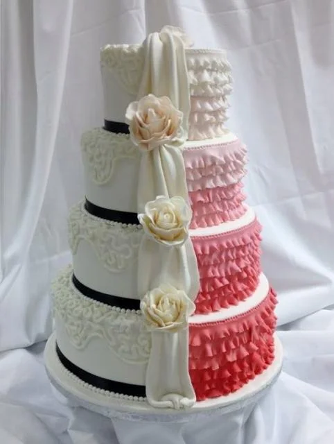 Two sided 4 tier round wedding cake with ruffles _amp_ drape dividing.jpg