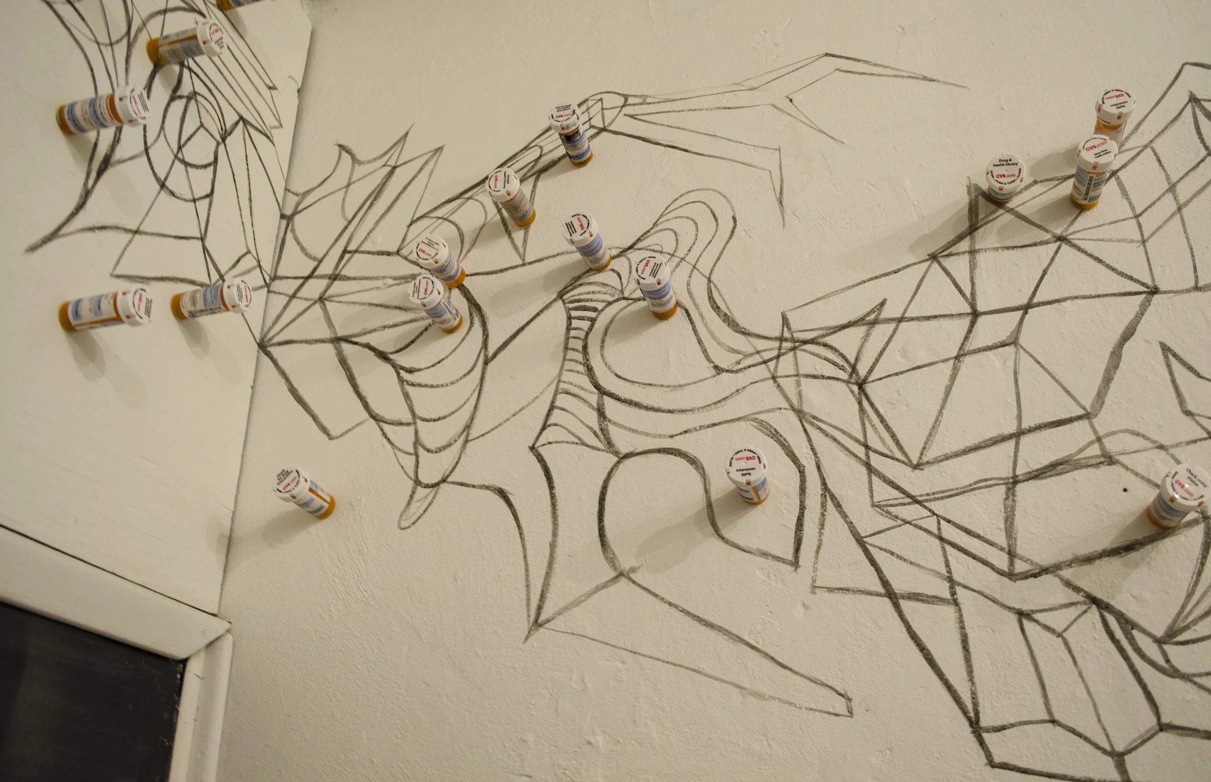 Detail of direct drawing and empty pill bottles