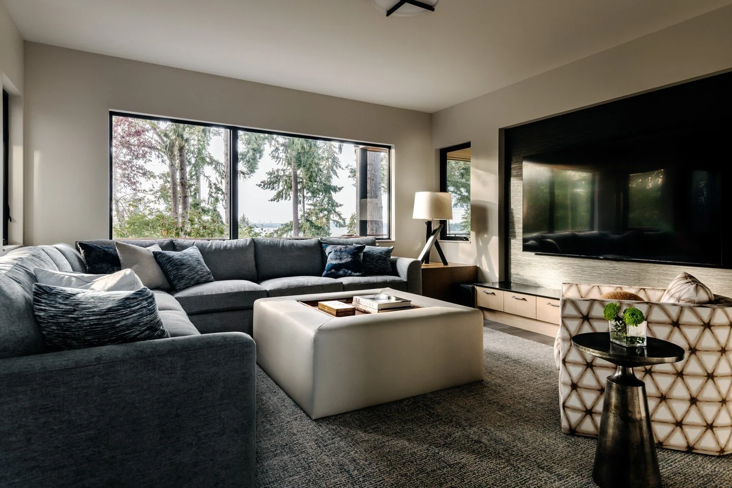 At CKID, our focal point is effective and elevated design.  The media room in our Tree View project is no exception.  A custom cocktail ottoman anchors the space. The tray insert serves a dual purpose, along with other thoughtful pieces throughout th