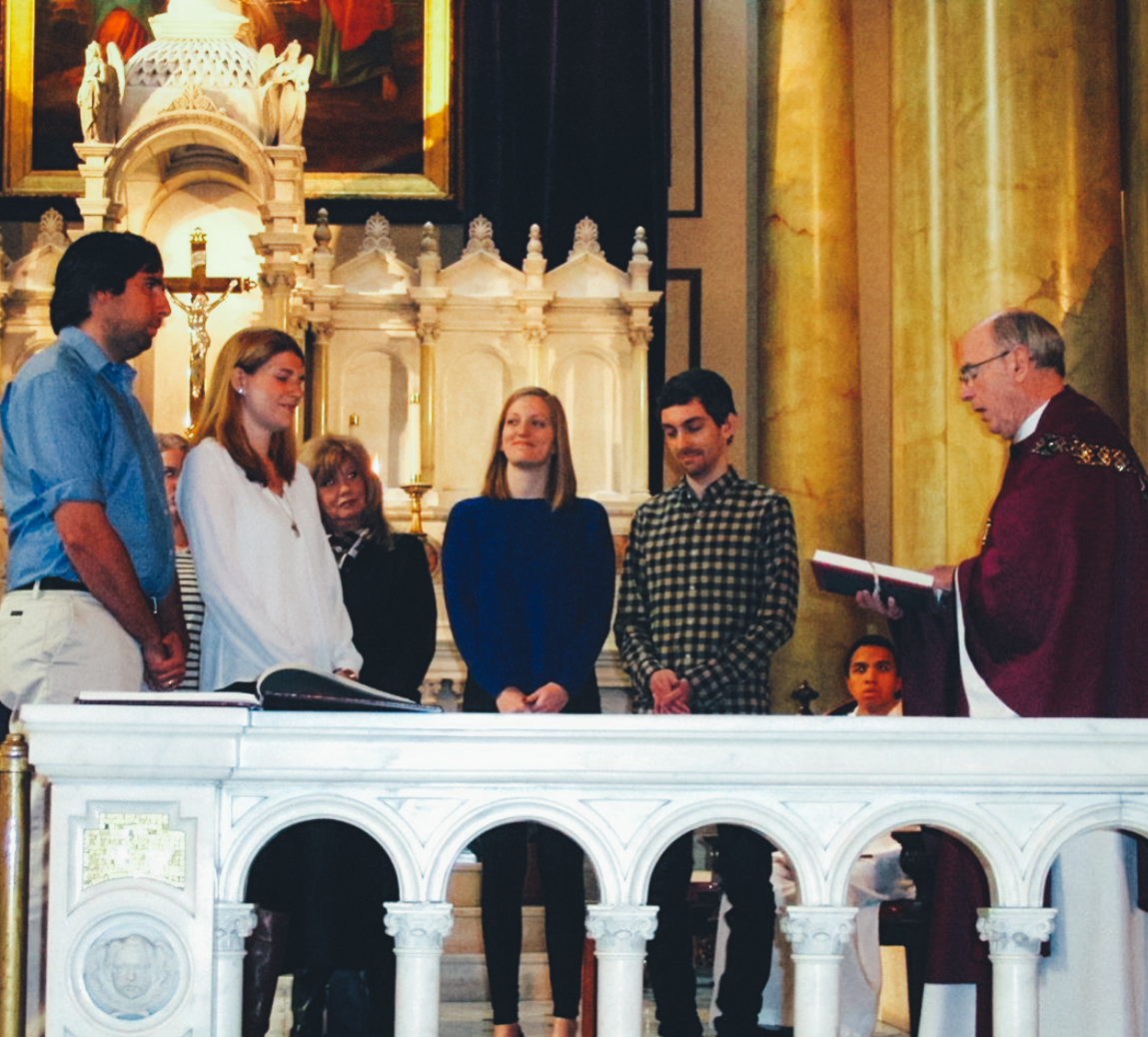 Angela Daubert, London Trusik, and Becky Mueller celebrate the Rite of Sending Forth with Father Bill before going to the Cathedral Basilica to the Rite of Election on the First Sunday of Lent with Archbishop Charles Chaput.