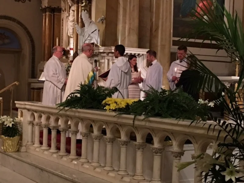 The Newly Baptized Receiving the "Light of Christ."