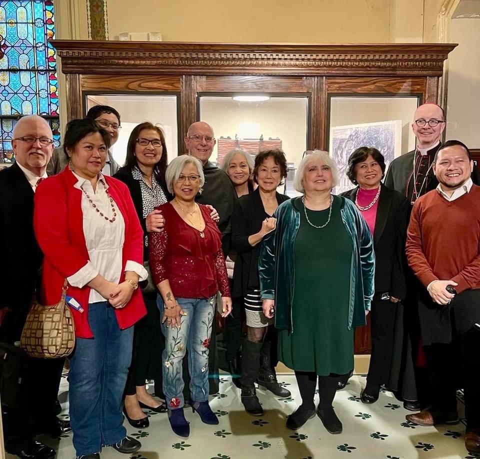   Members of the Saint Augustine Church Filipino Choir with Rev. Bill Waters, OSA, (Pastor) and Bishop Timothy Senior (Auxiliary Bishop of the Archdiocese of Philadelphia) after the Welcome Home Ceremony and Bell Blessing.  
