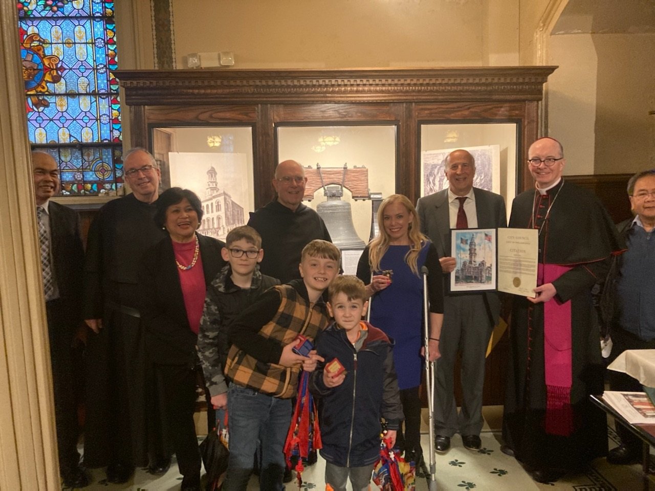   Parishioners with Councilman Mark Squilla as he presents a Citation from City Council of the City of Philadelphia, Honoring and Celebrating The “Sister of the Liberty Bell,” to Bishop Timothy Senior, Auxiliary Bishop of the Archdiocese of Philadelp