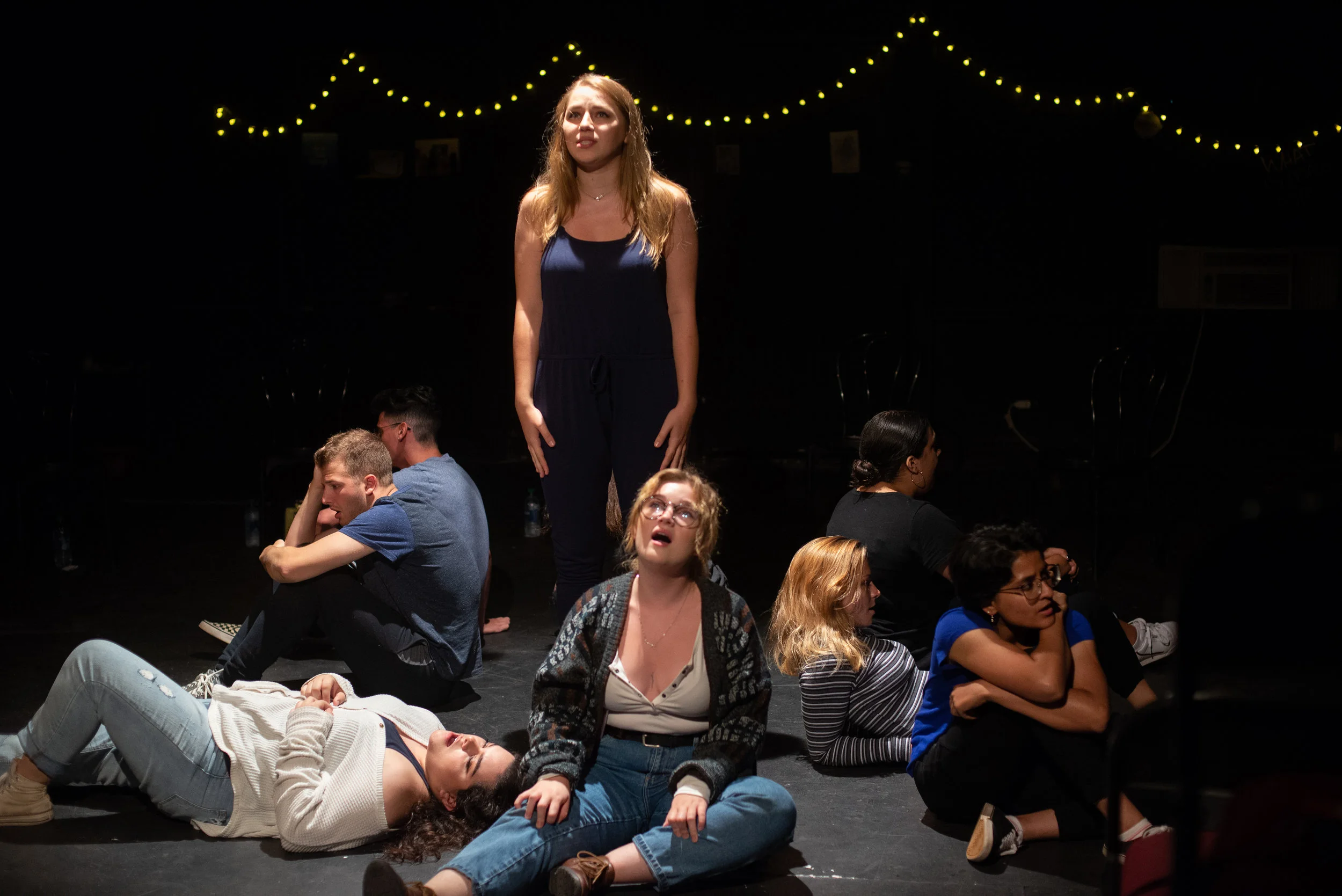 Alison standing center surrounded by the rest of the cast, their voices will floor you.