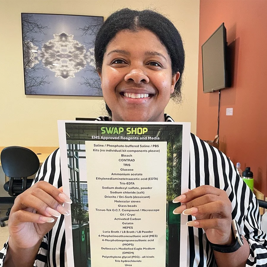 Boston Children's Hospital research labs EHS safety officer Marly Thomas shows Swap Shop approved reagents.