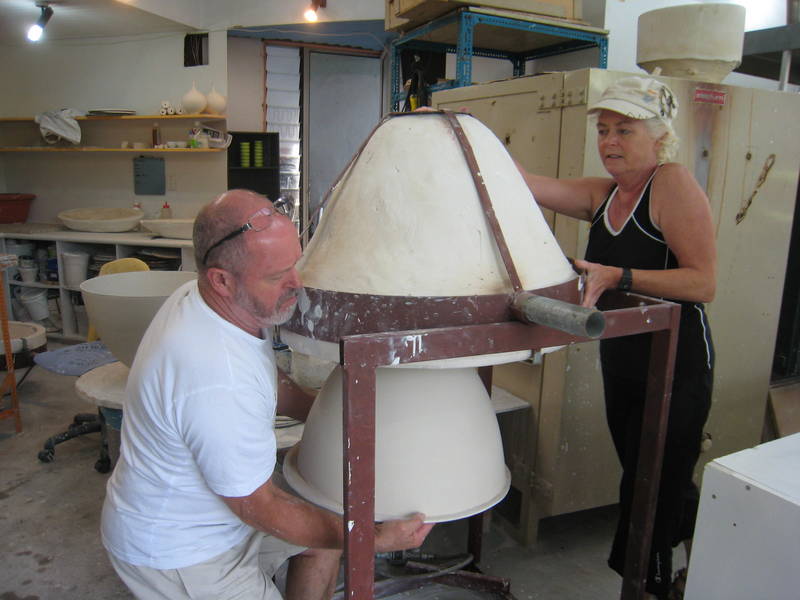 Pot being lowered out of mould