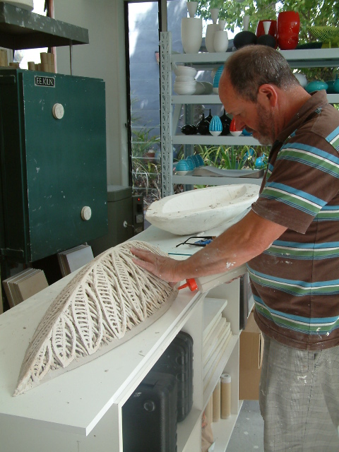 Rim being added before firing