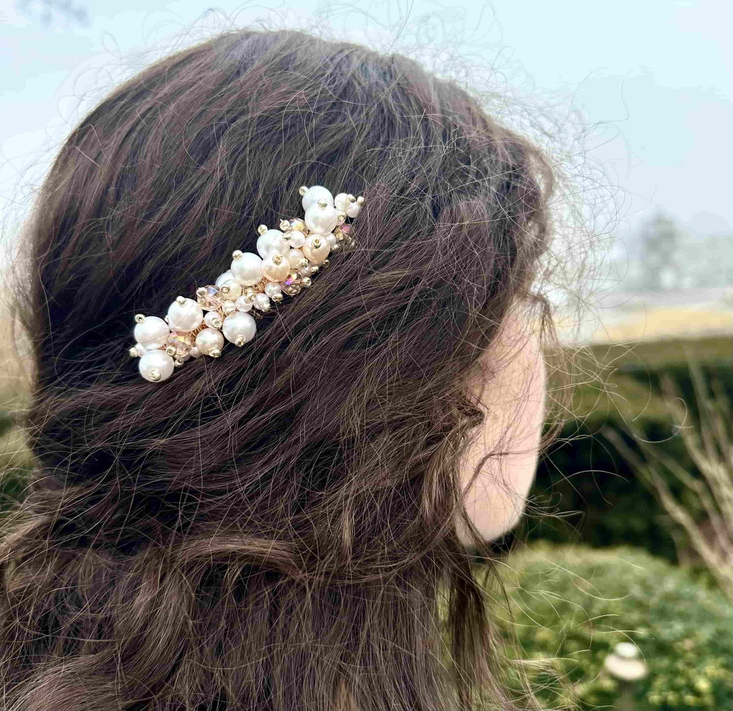 Pearl ivory and white bridal hair comb in dark hair