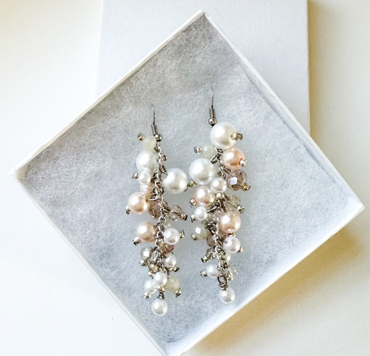 champagne cascade earrings with pearls, pink crystals on silver earwires in a box