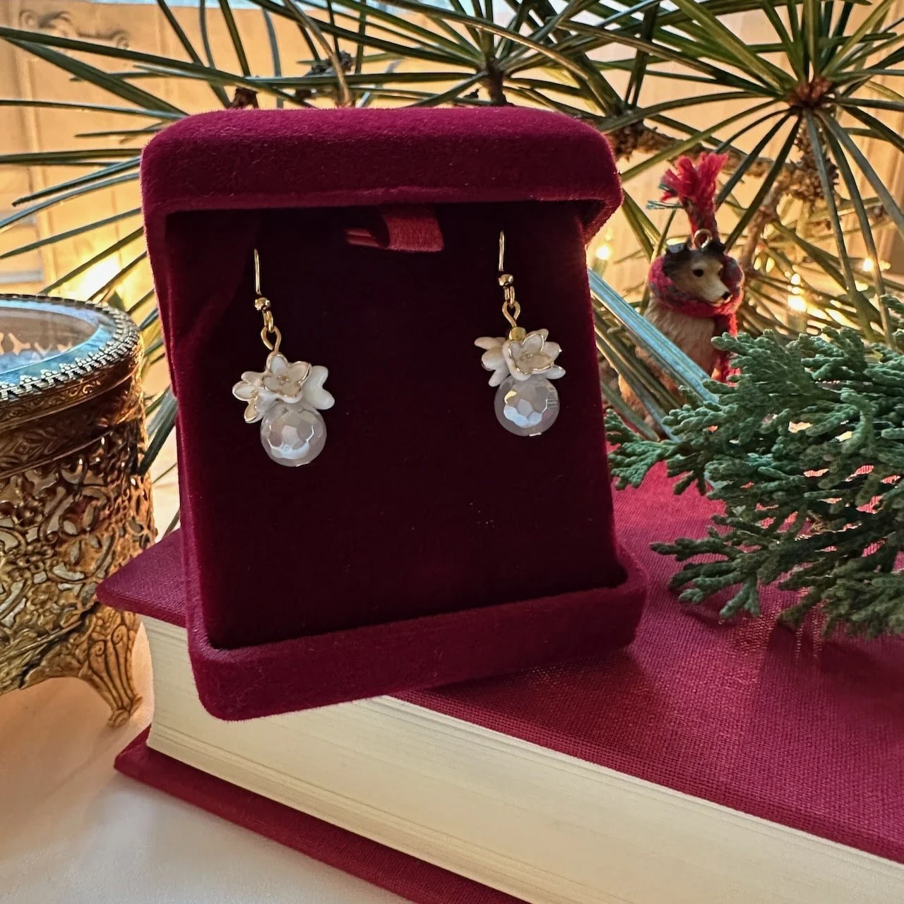 white-flower-gold-edge-dangle-earrings-red-velvet-box.jpeg