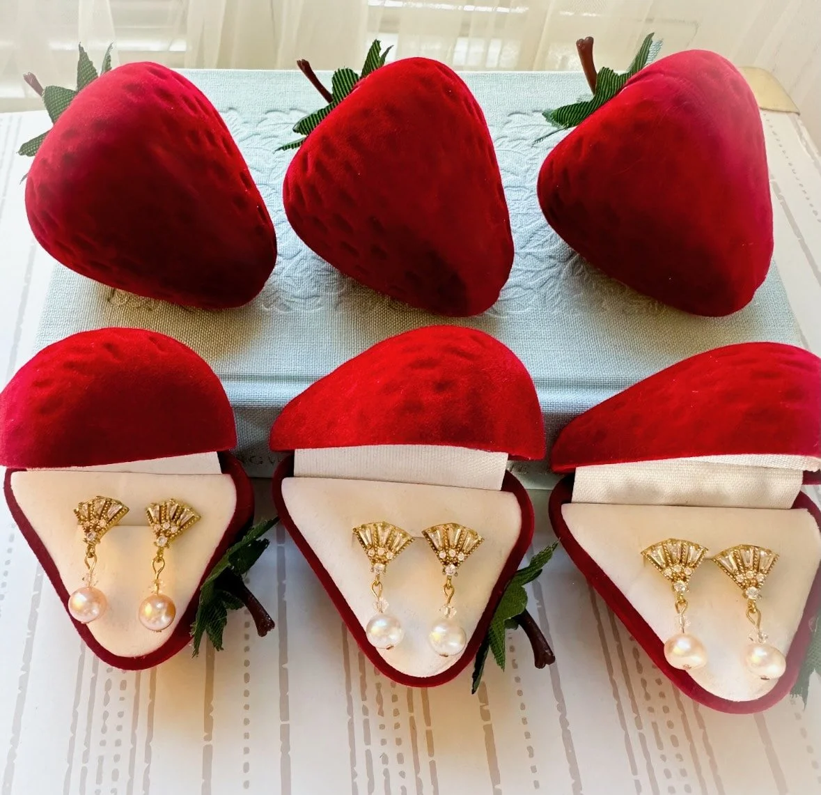Real pearl earrings, 1920s style, in red velvet strawberry box.