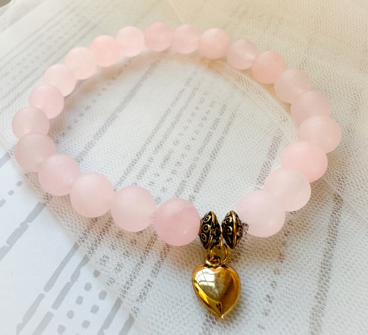 pink rose quartz bracelet with heart charm