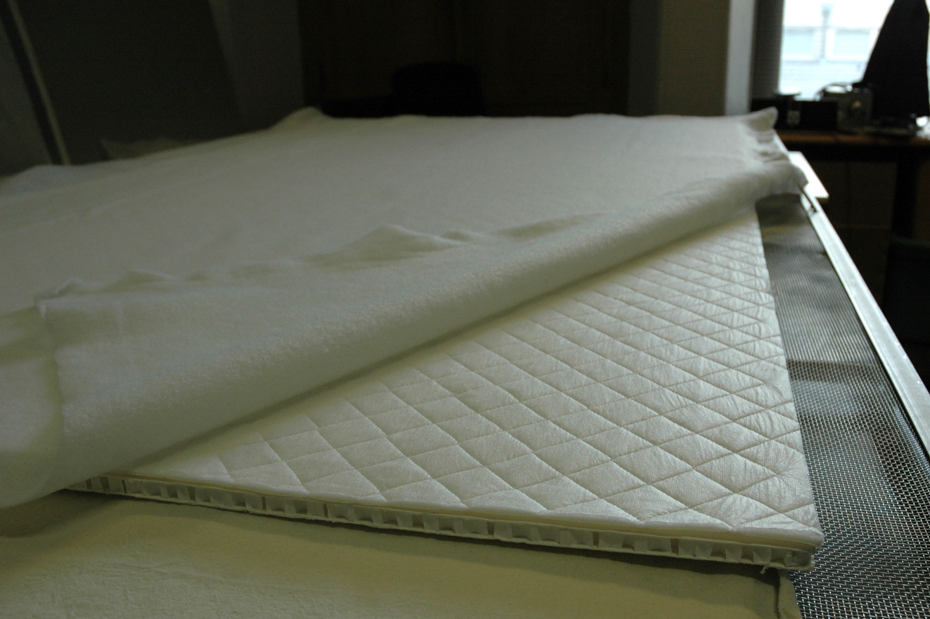 Creation of an oversized padded board to support and display the embroidery