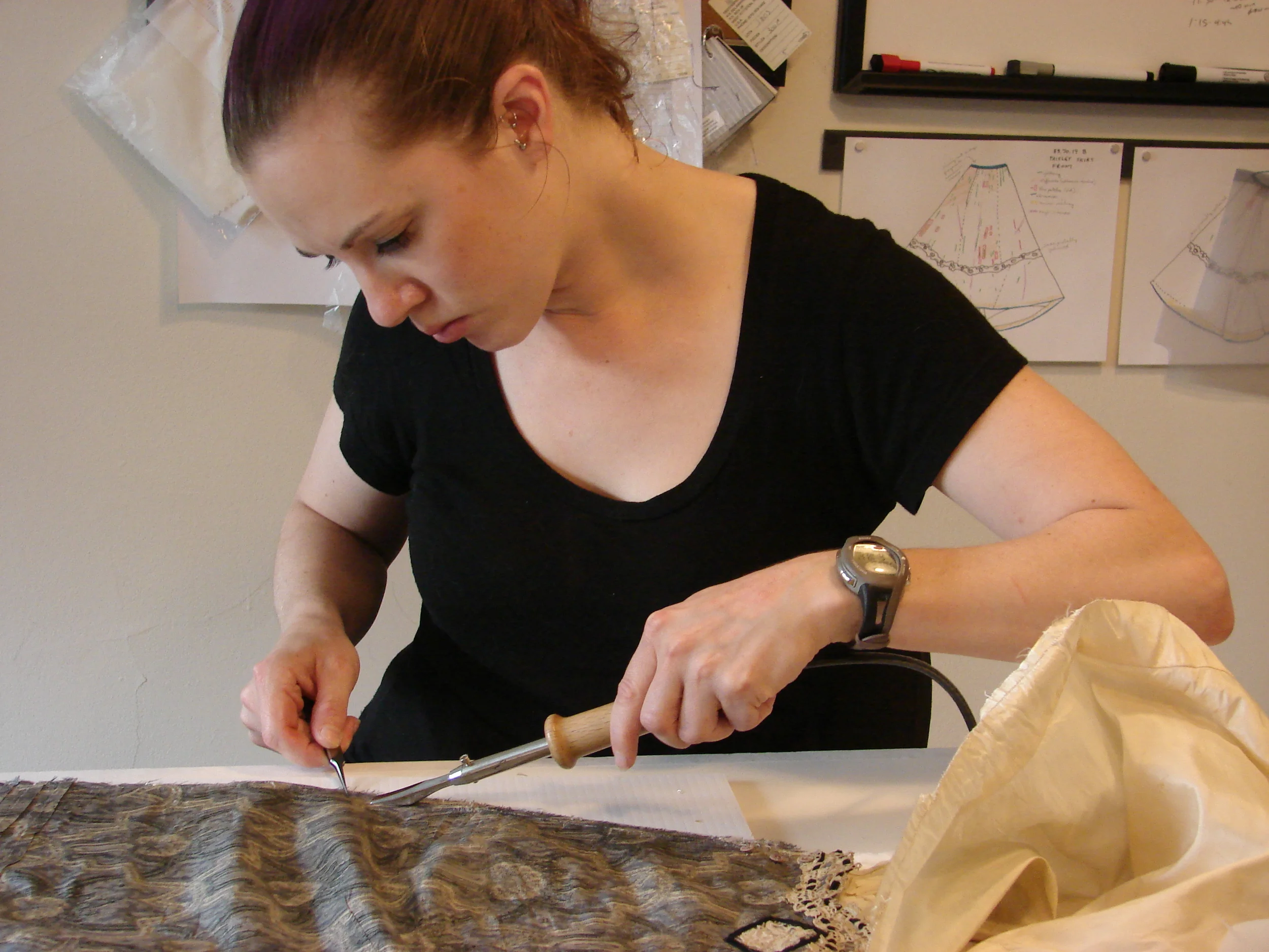 Obie treating a bodice sleeve