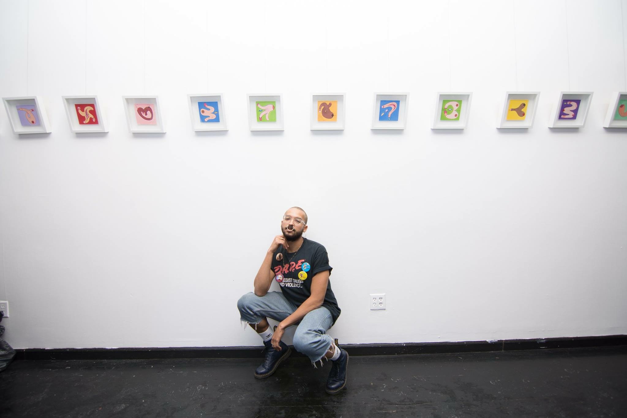 Jean-Sebastien Coles posing in front of his penginas. 
