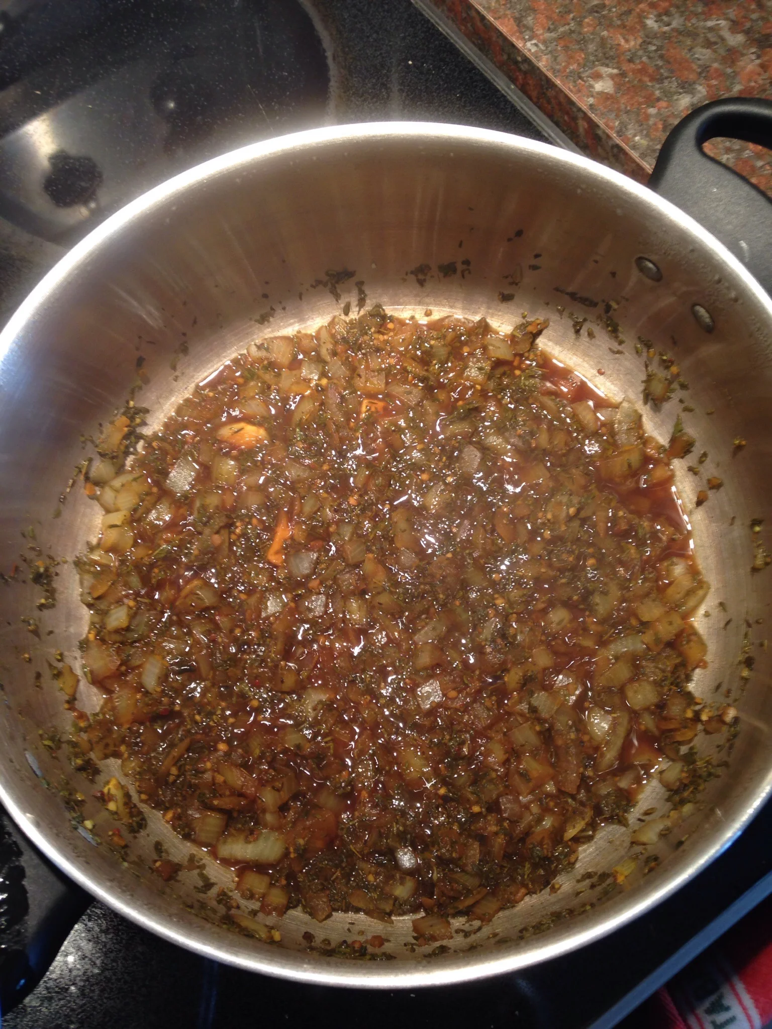 The onions, garlic, herbs and spices cooking with the soy sauce. 