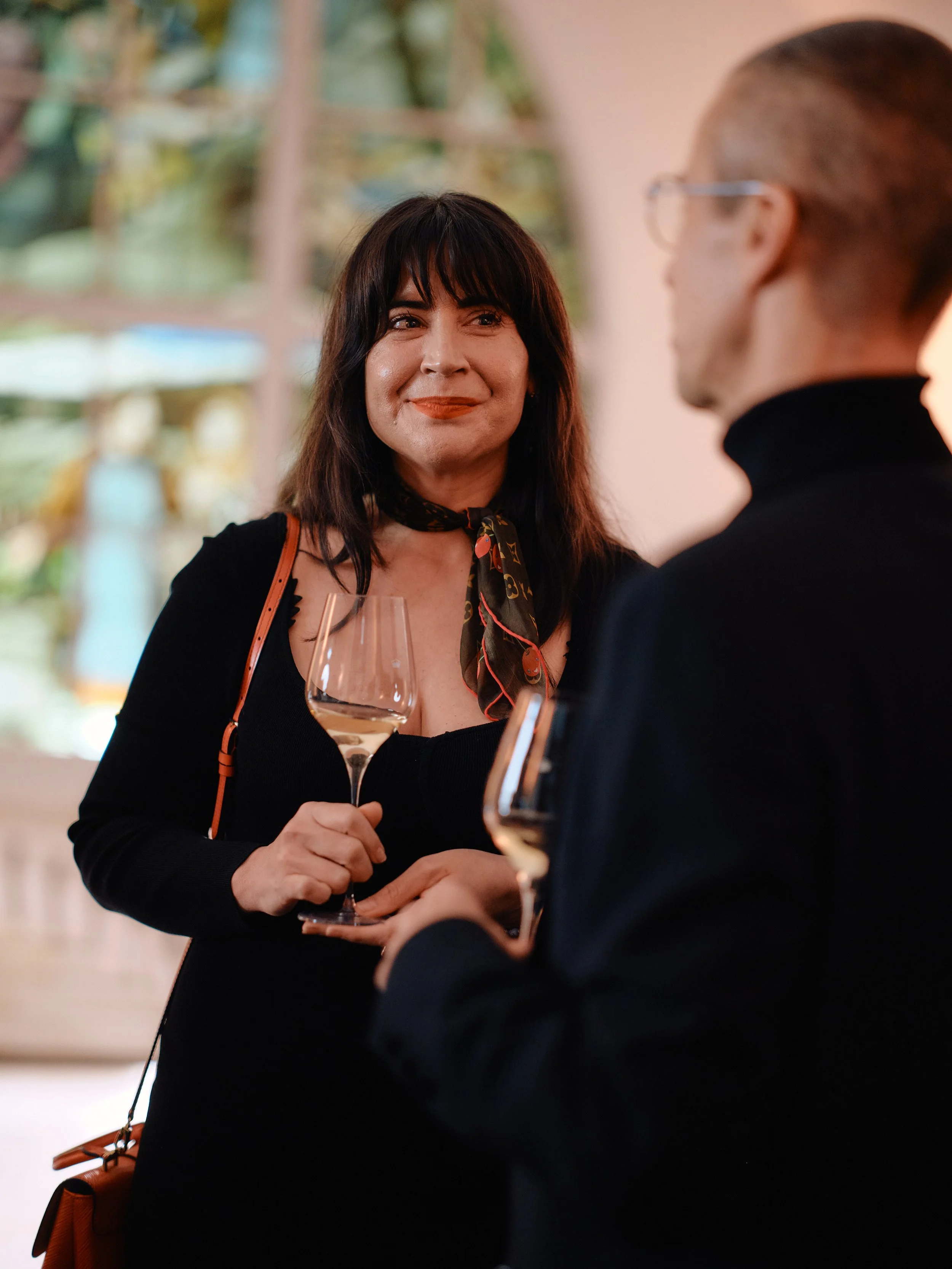 Laura the founder of Travel and Champagne with a glass of Moët and Chandon