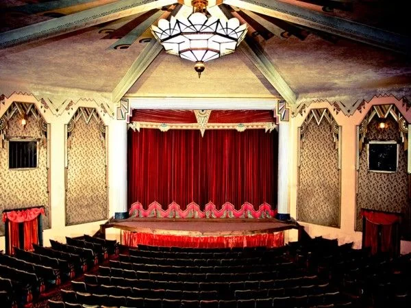 Interior shot of the Criterion Theatre prior to the full restoration; notice the keystone design element at the top of the Proscenium Arch.
