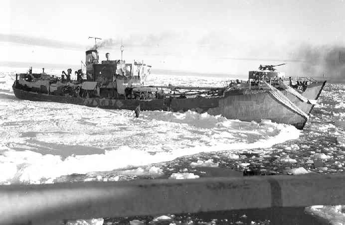 The trawler Externsteine, trapped in ice. After her capture, she was made a prize ship and rechristened USCGC Eastbreeze. She was turned over to the US Navy and renamed USS Callao (IX-205) in January 1945. She was decommissioned in 1950 and scrapped. 