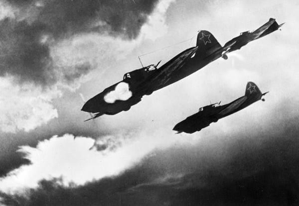A group of Il-2s make a diving attack with their 23mm cannon.