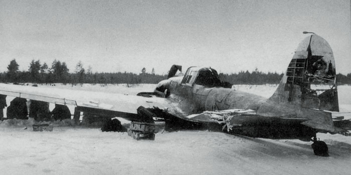 This Il-2M3 has made a wheels-up landing following severe flak damage to the vertical stabilizer. Note the crude whitewash pattern applied over the aircraft's camoflauge. Whitewash was generally applied in the field with whatever materials were on hand- it frequently wore off after a few weeks. 