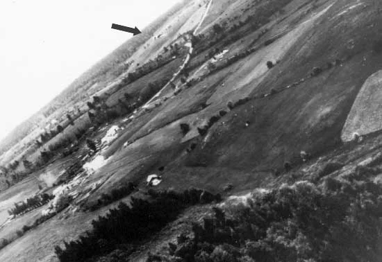 An in-flight picture taken during a Shturmovik attack on German vehicles- the arrow indicates an attacking Il-2 ahead of the camera aircraft.