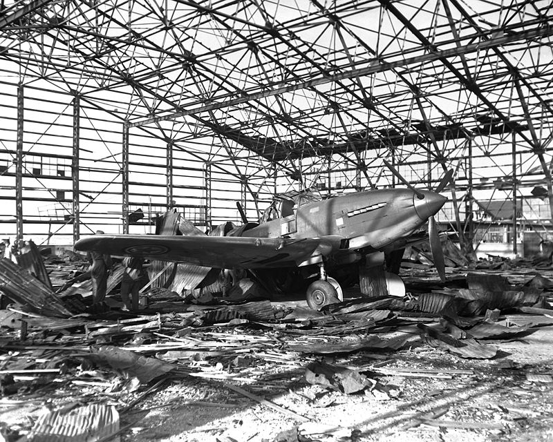 A North Korean Air Force Il-10 sits in the ruins of a destroyed hangar at Kimpo airfield.