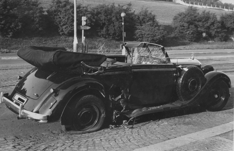 THE REMNANTS OF HEYDRICH'S CAR FOLLOWING THE ASSASSINATION. THE DAMAGE CAUSED BY THE GRENADE BLAST IS EVIDENT- PIECES OF THE CAR AS WELL AS GRENADE SHRAPNEL WERE PROPELLED INTO THE INTERIOR AND INTO HEYDRICH. 