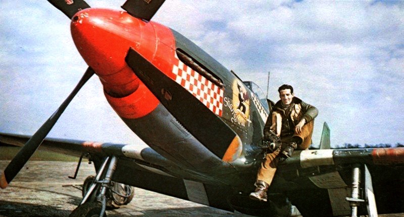 Captain Don Gentile poses with his P-51B Mustang in the spring of 1944. After serving with one of the RAF's Eagle Squadrons (composed of American volunteers) and shooting down two aircraft, Gentile transferred to the USAAF, eventually flying with the 4th Fighter Group. During early 1944, while flying the Mustang, he shot down 15.5 enemy planes, making him the highest-scoring ace in 8th Air Force at the time. Source: Wikipedia.
