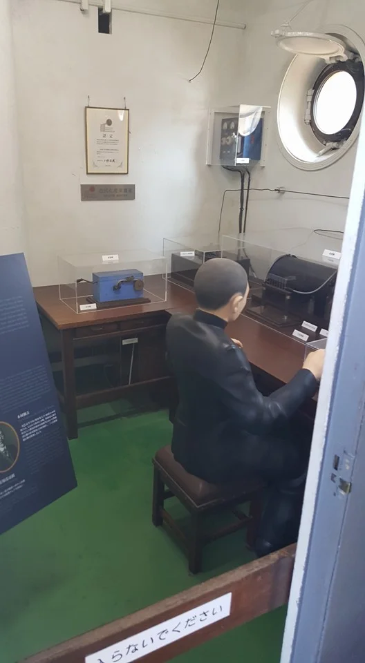 A typically restored room on board the Mikasa, in this instance the communications room. A number of artifacts are on display with the aid of placards. Photo: author.