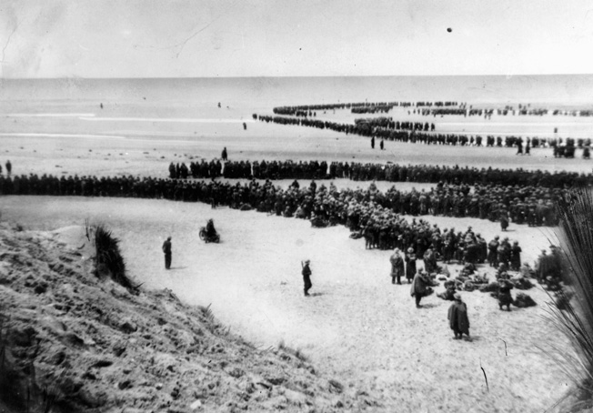 Among the most famous images captured during the evacuation of Dunkirk was this: the image of thousands of British troops waiting on the sands of the French coast in hopes of being evacuated. Photo source: Warfare History Network.