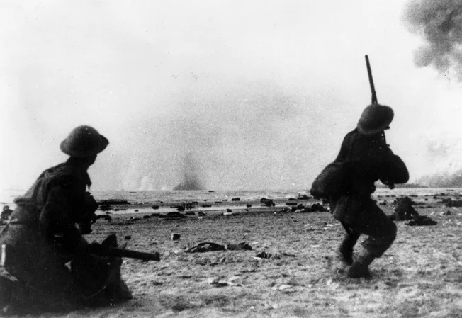 Amidst one of the seemingly endless Luftwaffe attacks, BEF soldiers take aim at attacking bombers with their rifles. Source: Warfare History Network.
