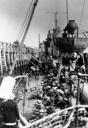 British soldiers board a destroyer at the mole at Dunkirk. Photo source: Warfare History Network.