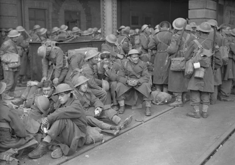British soldiers, just having arrived at Dover exhausted from their ordeal in France, await a train to take them north. Photo source: Wikipedia.