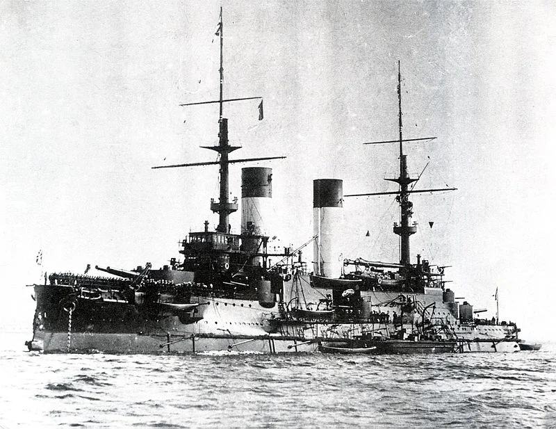THE BATTLESHIP KNYAV SUVOROV, ROHESTVENSKY'S FLAGSHIP. HIT COUNTLESS TIMES BY JAPANESE GUNFIRE, INCLUDING A HIT WHICH INCAPACITATED THE ADMIRAL WITH A HEAD WOUND, THE BATTLESHIP WAS ABANDONED AND SANK. PHOTO: WIKIPEDIA.