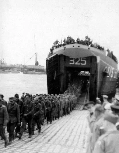 German prisoners debarking USS LST-325 in England following the invasion of Normandy. Photo source: Navsource.org.