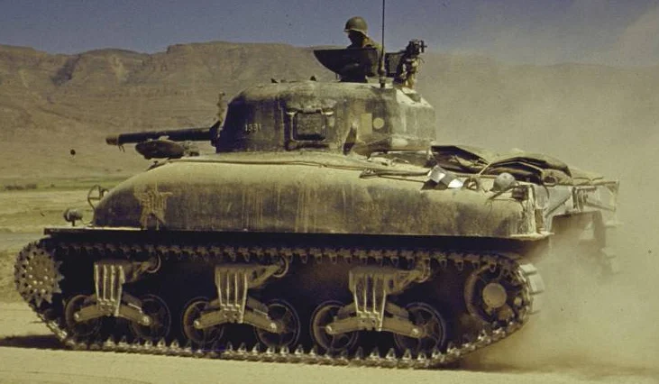An M4A1, showing the rounded hull that was standard with early-model Shermans. Photo source: Life Magazine.