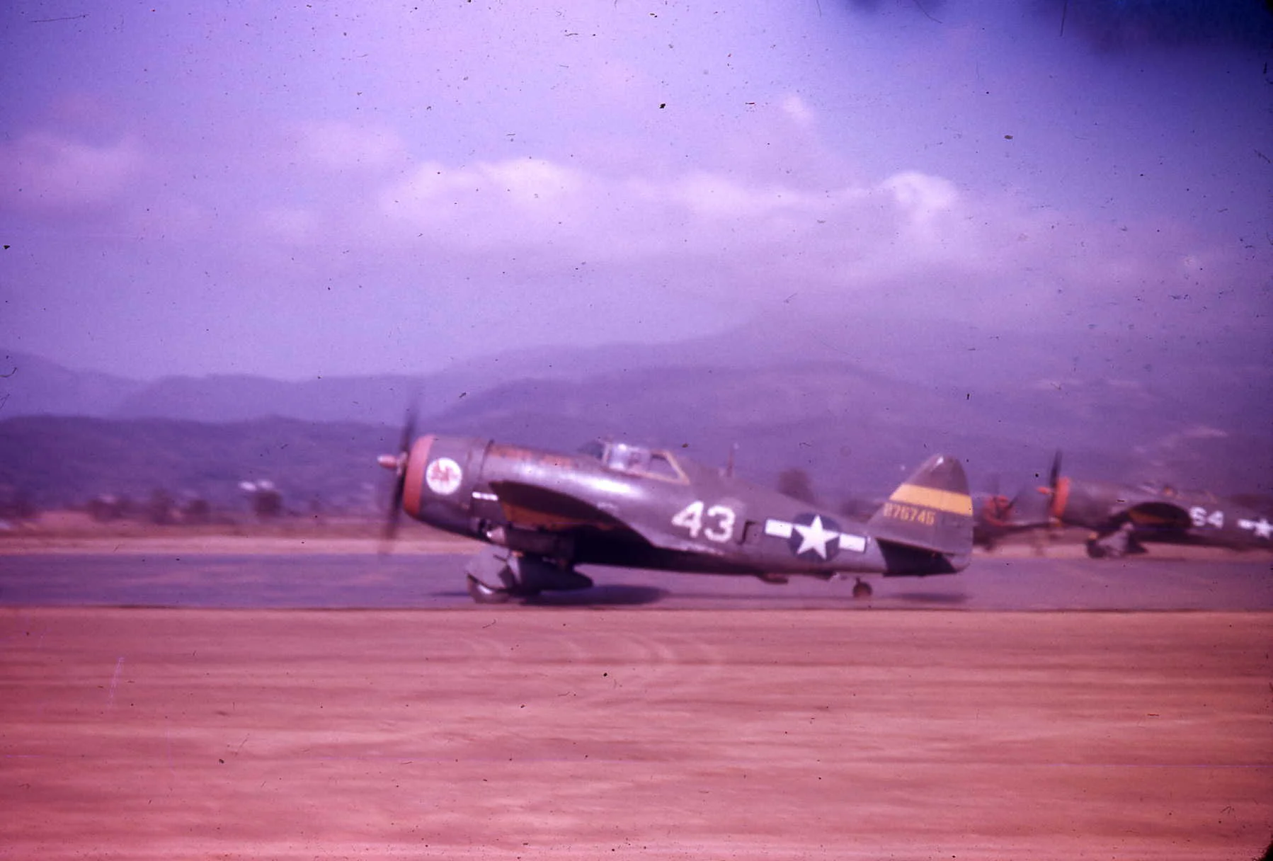 Two P-47Ds from the 65th Fighter Squadron take off for a ground attack mission in Italy from their base in Corsica. This squadron along with others in Corsica participated in a vigorous interdiction campaign in central and northern Italy called Oper…
