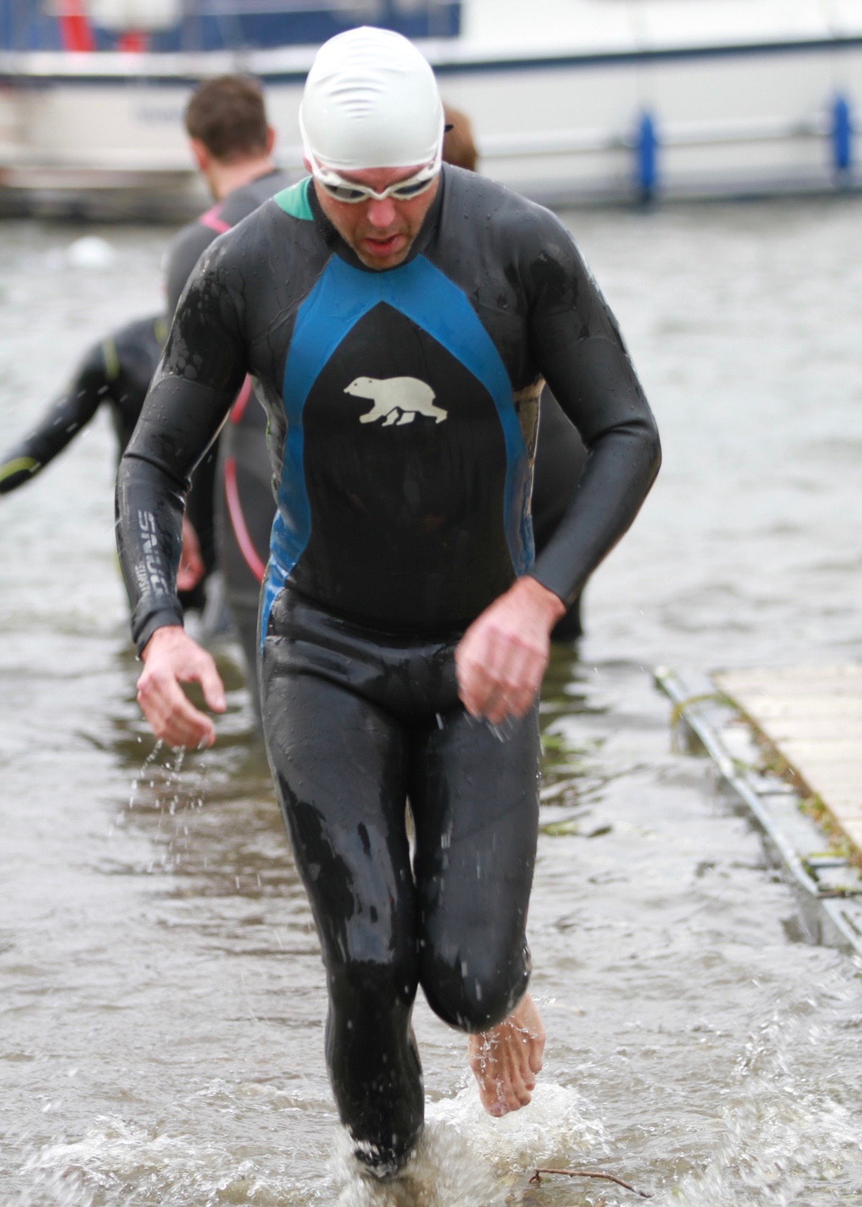 Out of the Swim, a little dizzy. Onwards to the bike