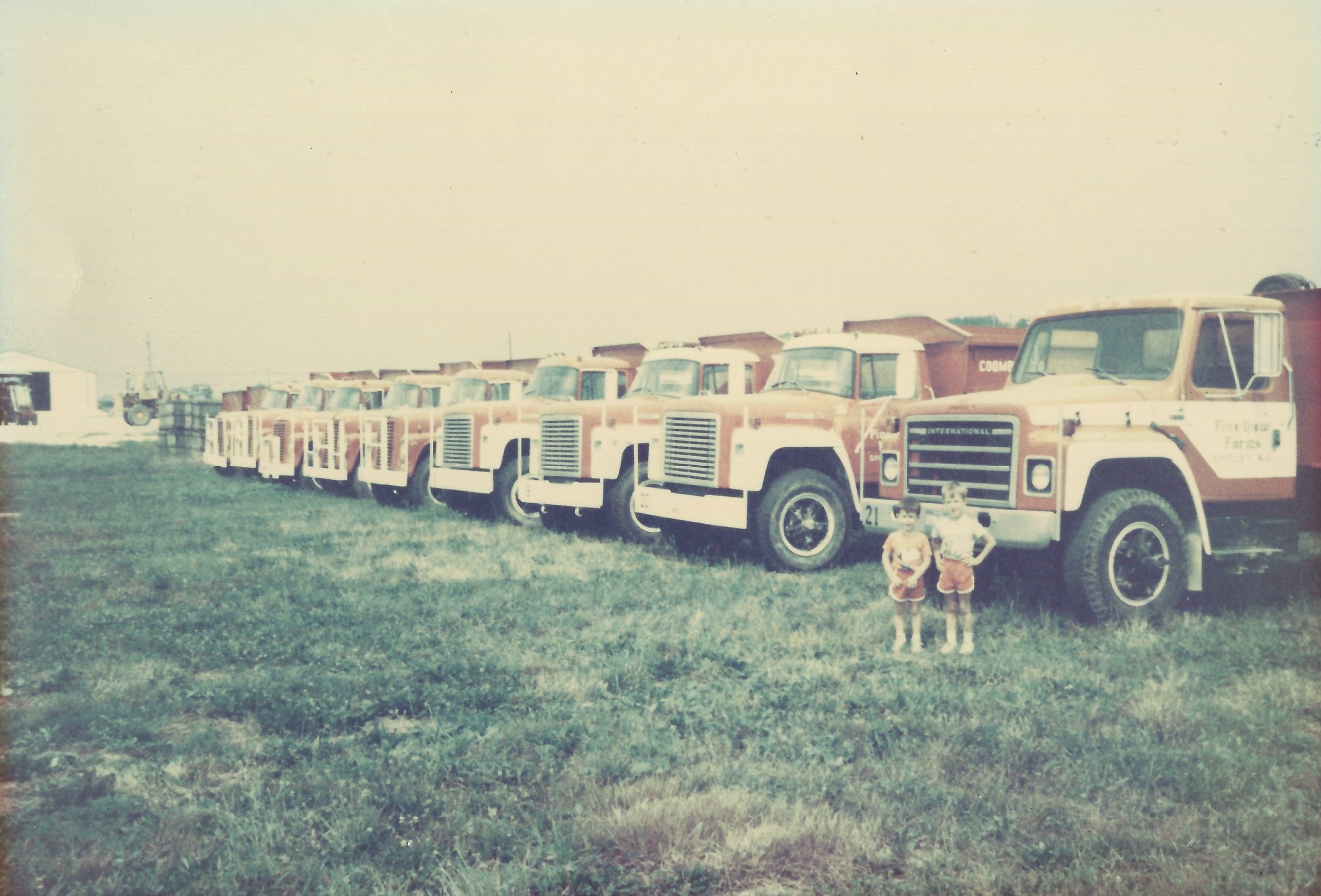  George and John Jr with farm fleet 1987 