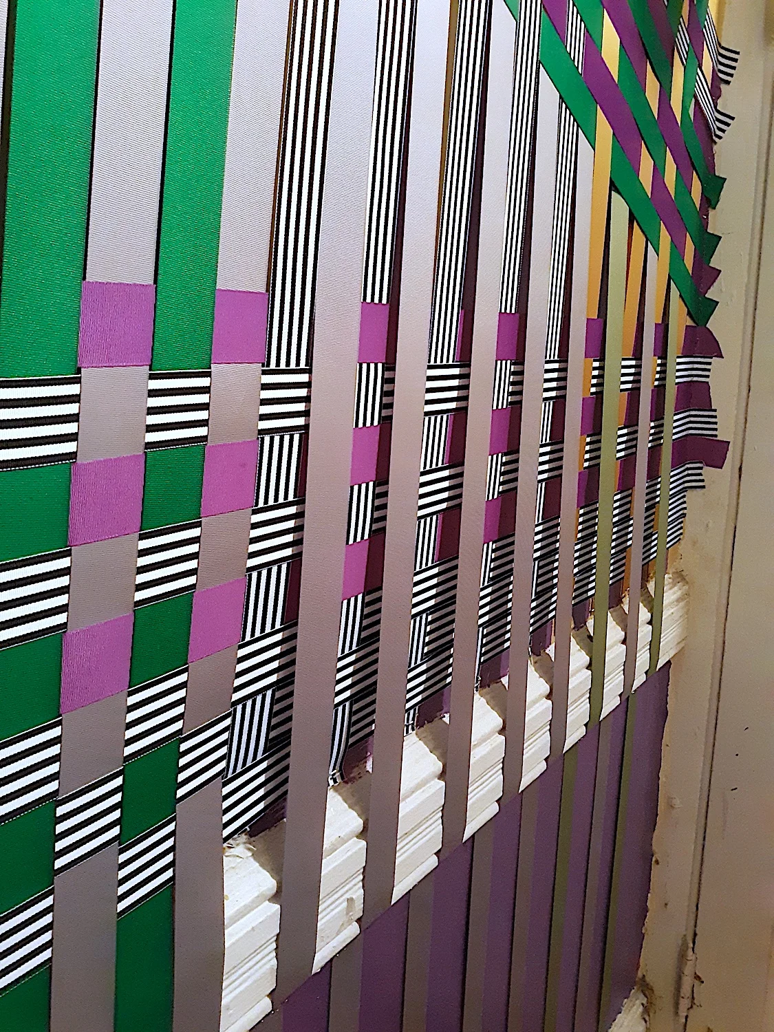 System of My Losses III, 2019 / grosgrain and satin ribbon / dimensions variable / site-specific installation in Diane's Circus, Brooklyn, NY