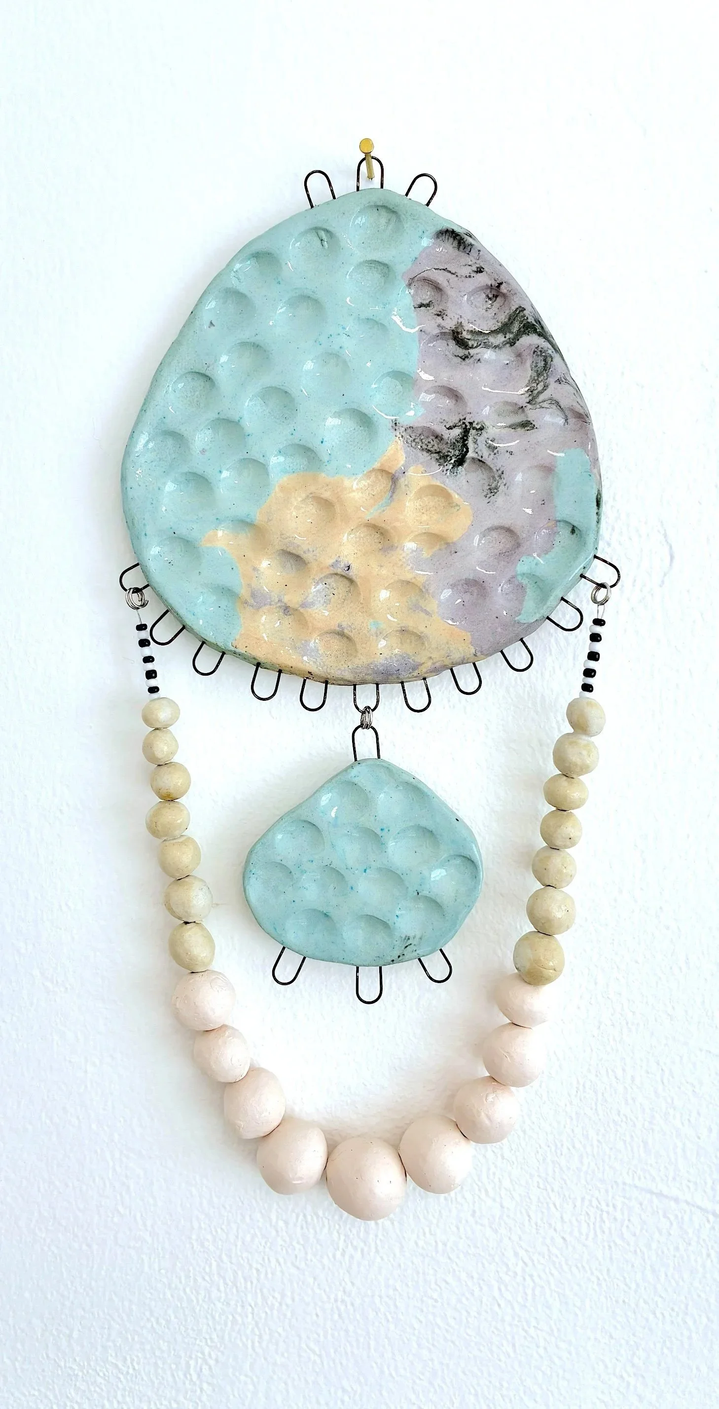 many moons before and behind, 2026 / stained and glazed ceramic, metal wire, glazed and unglazed ceramic beads, jewelry findings / 12 x 5.5 inches