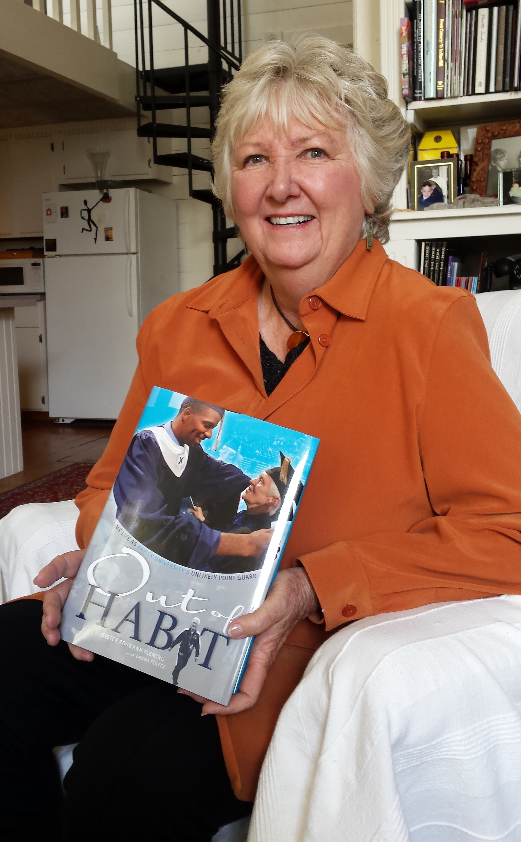 Laura Pulfer with Out of Habit, a book published for Xavier University to celebrate its beloved nun, Sister Rose Ann Fleming