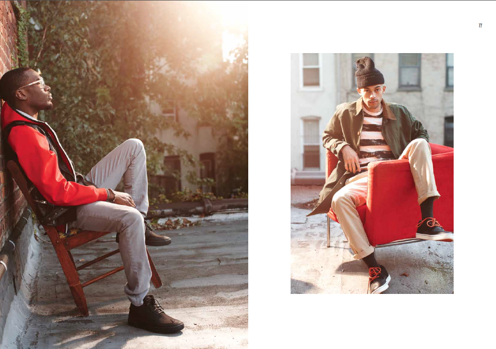 CAT - Male model on roof in chairs.png