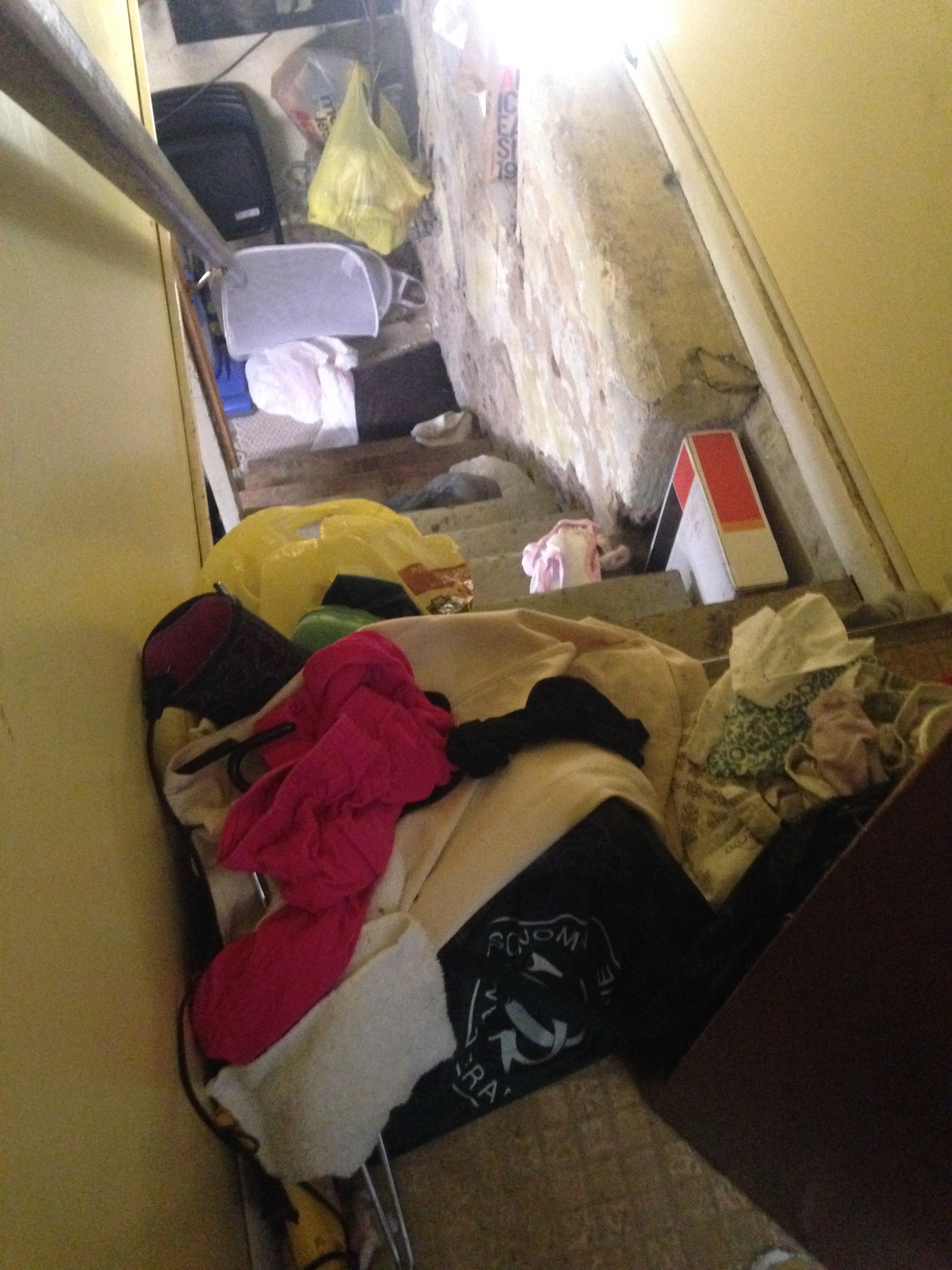 Laundry thrown half-way down the basement stairs...