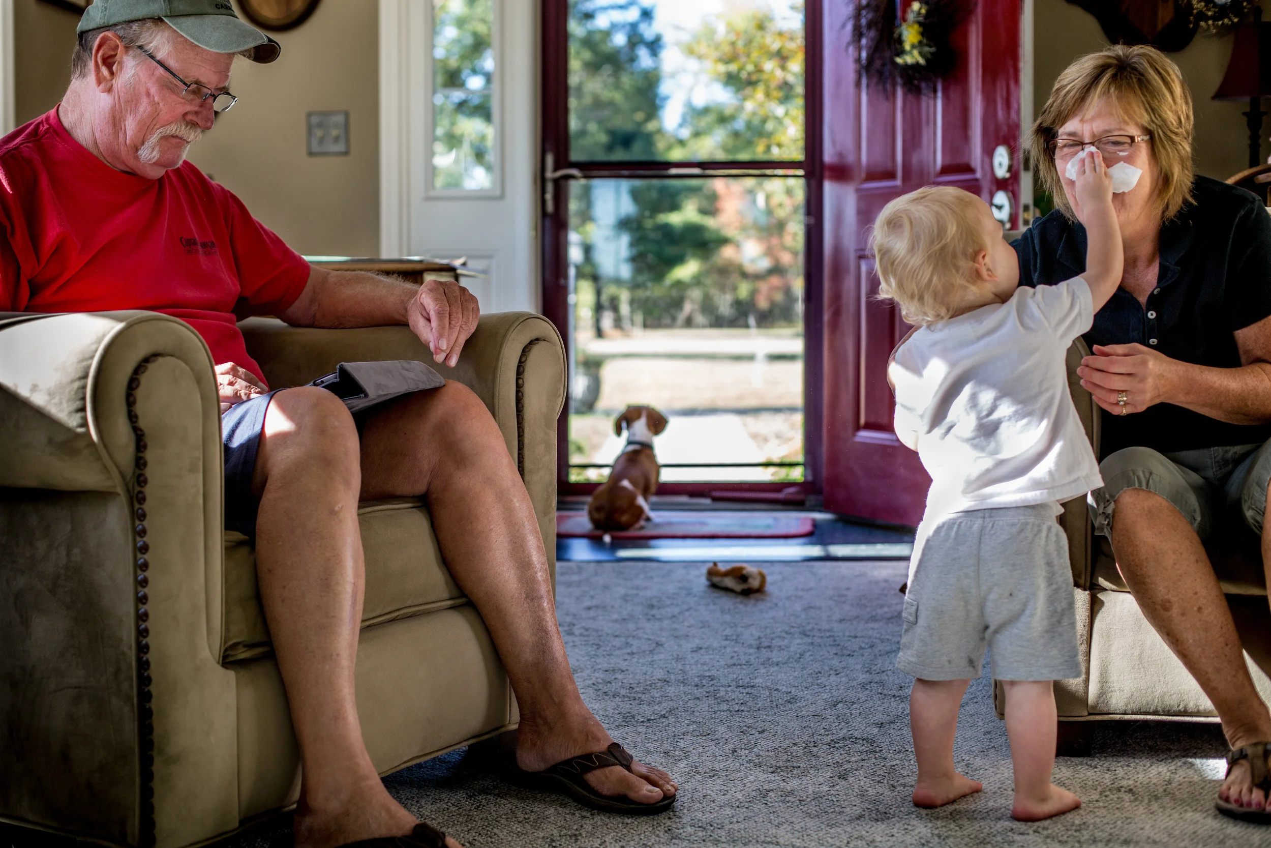   Tom and Chris Frame enjoy a morning with their youngest grandchild, Tommy. It’s the morning time that Tom reflects and remembers all his brothers that died in Vietnam. He calls himself the “fortunate son” for returning home.  